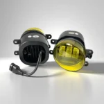 Yellow cylindrical fog lamp product featuring projector lens design for improved visibility in foggy conditions