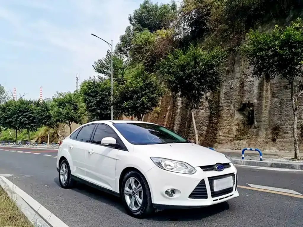 2010 Ford Focus front-end close-up featuring our projector headlights, upgraded with bi projector headlights for improved night driving visibility.
