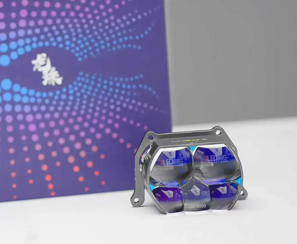 Aftermarket projector headlights displayed on a desk with export packaging boxes in the background, showing product and protective packing together.