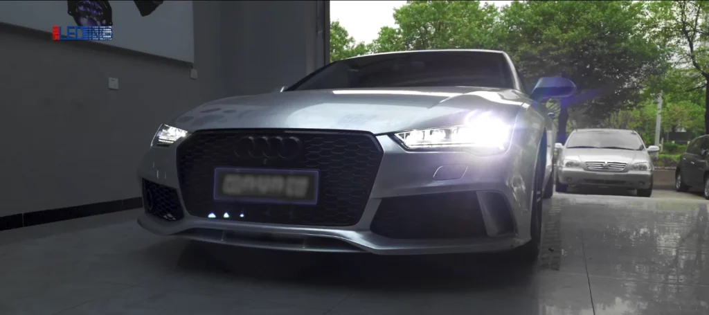 Audi with our LED projector headlights turned on, showing focused beam pattern and bright illumination