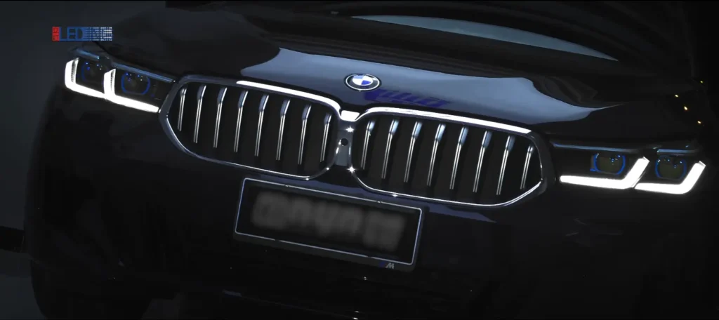 BMW fitted with our projector (lens) headlights after a retrofit, front lighting upgrade shown in a finished install photo