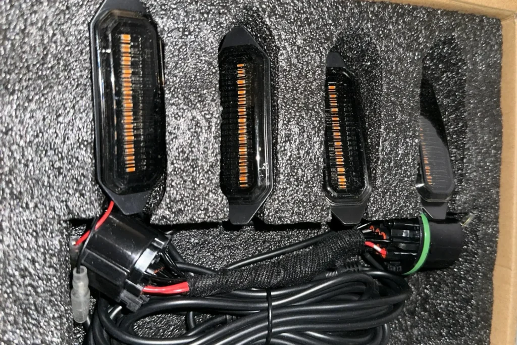 Unboxed grille light kit showing the lights and included high-quality wiring inside the packaging.