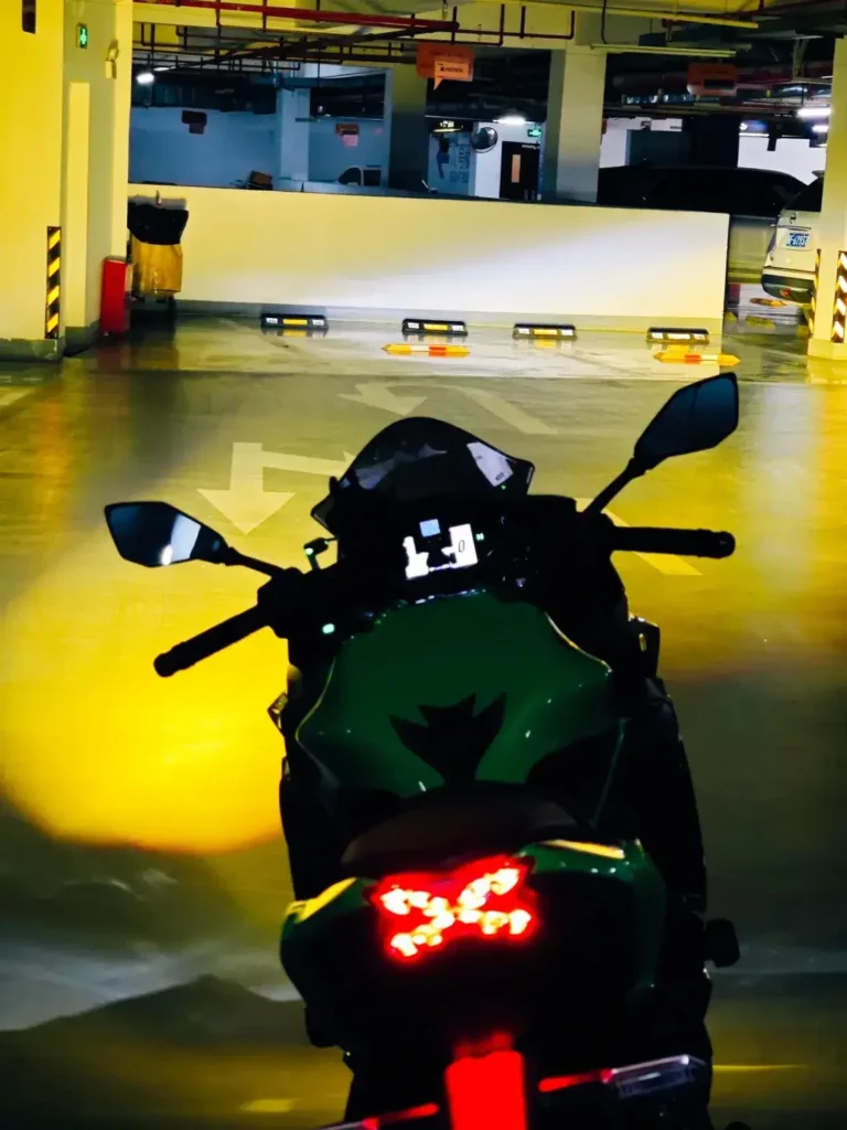 Motorcycle headlight testing in progress, evaluating beam pattern and glare control with projector headlights for bikes