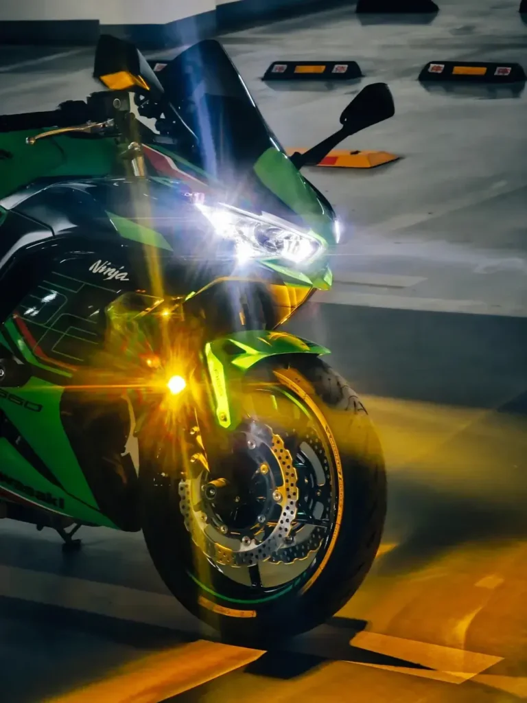 Black-and-white portrait of a black motorcycle after a headlight upgrade with projector headlights for bikes