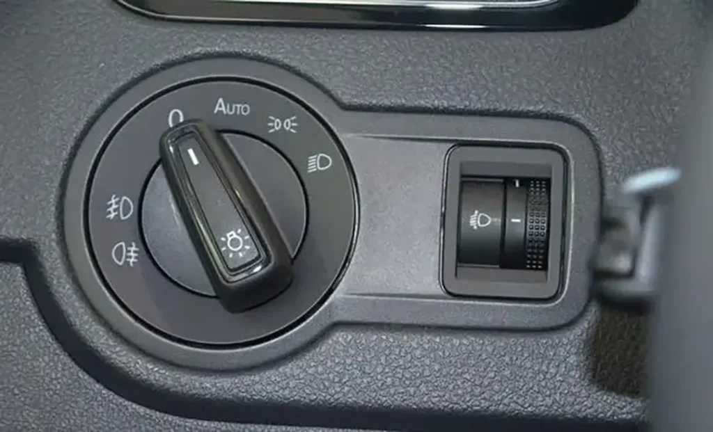 Close-up of a rotary headlight switch showing lighting modes but no front fog lights setting, highlighting the trend of fog lights being deleted and what it means for LED fog lights for cars.