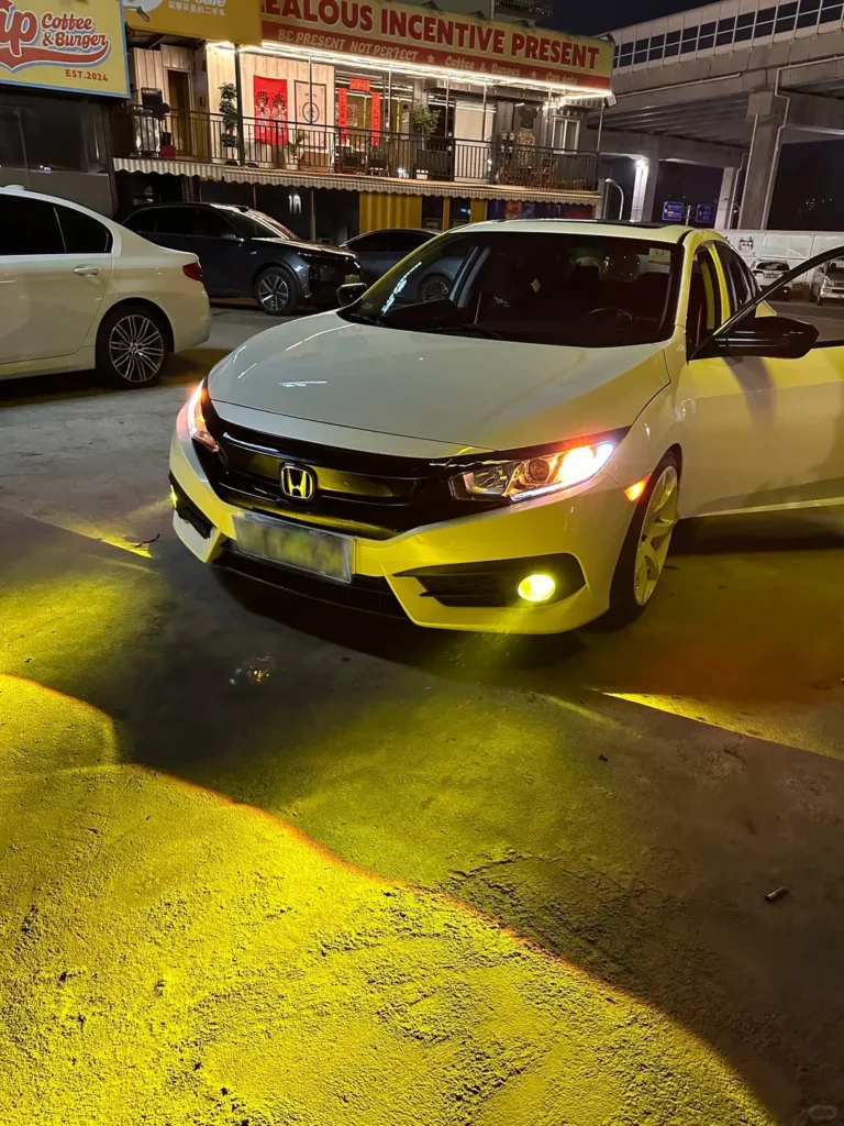White Honda after installing our fog lights; fog lights car setup designed to improve visibility in fog, rain, and low-light driving.