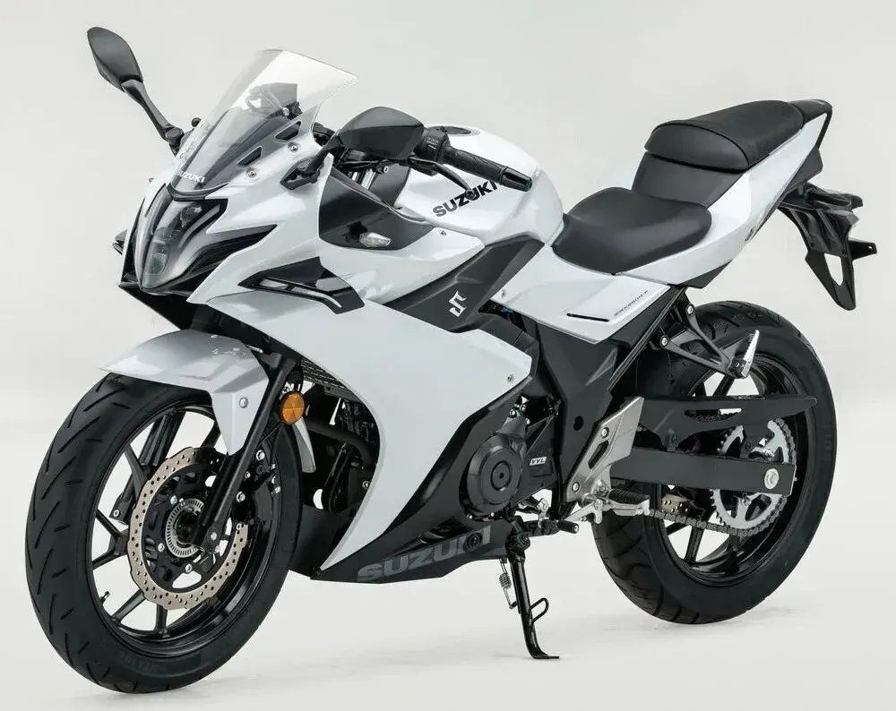 White Suzuki GSX250R motorcycle on a light gray background with projector headlights