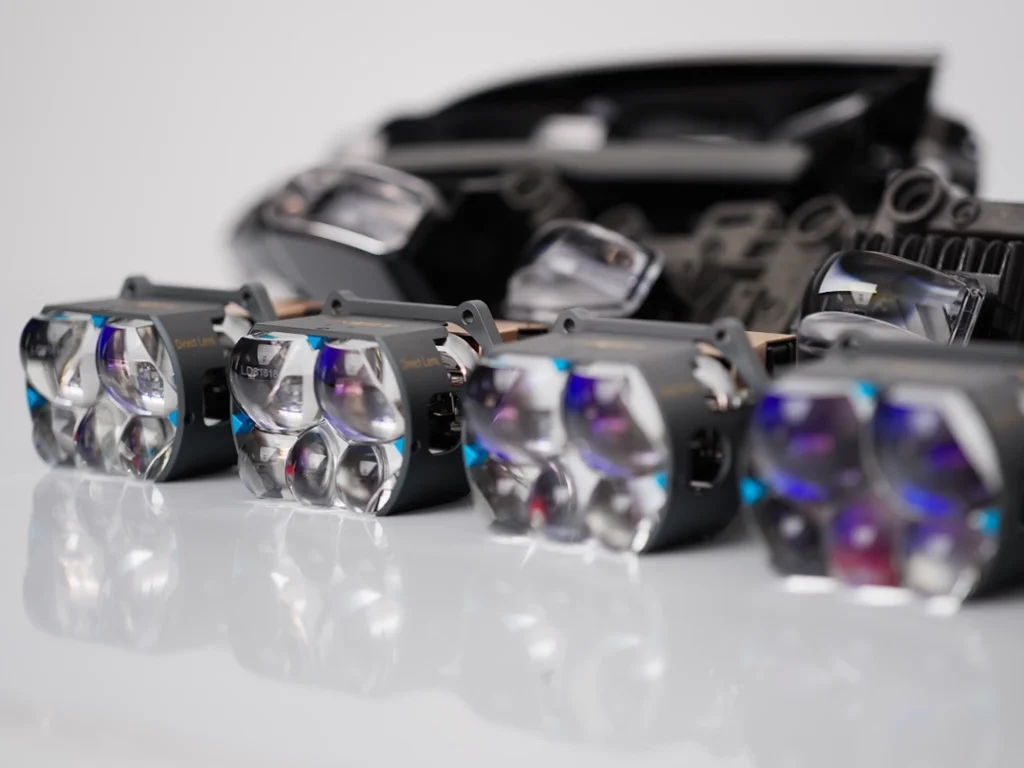 How do projector headlights work? Close-up of a projector headlight convex lens.