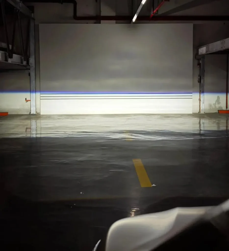 How to align projector headlights: wall test showing calibration lines and a sharp low-beam cutoff pattern.