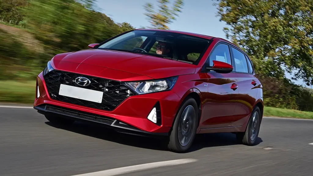 Hyundai i20 driving on a highway after a projector headlight upgrade—i20 projector headlight price guide.