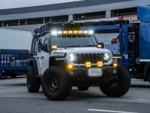 Jeep Wrangler with LEDING roof-mounted spotlights and front spotlights installed, for a how to wire spotlights on a car guide