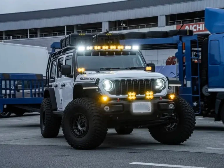 Jeep Wrangler with LEDING roof-mounted spotlights and front spotlights installed, for a how to wire spotlights on a car guide