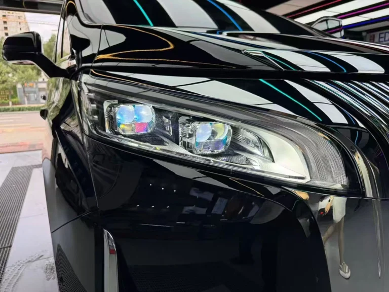 Close-up of Leding five-eye projector headlights installed on a black car