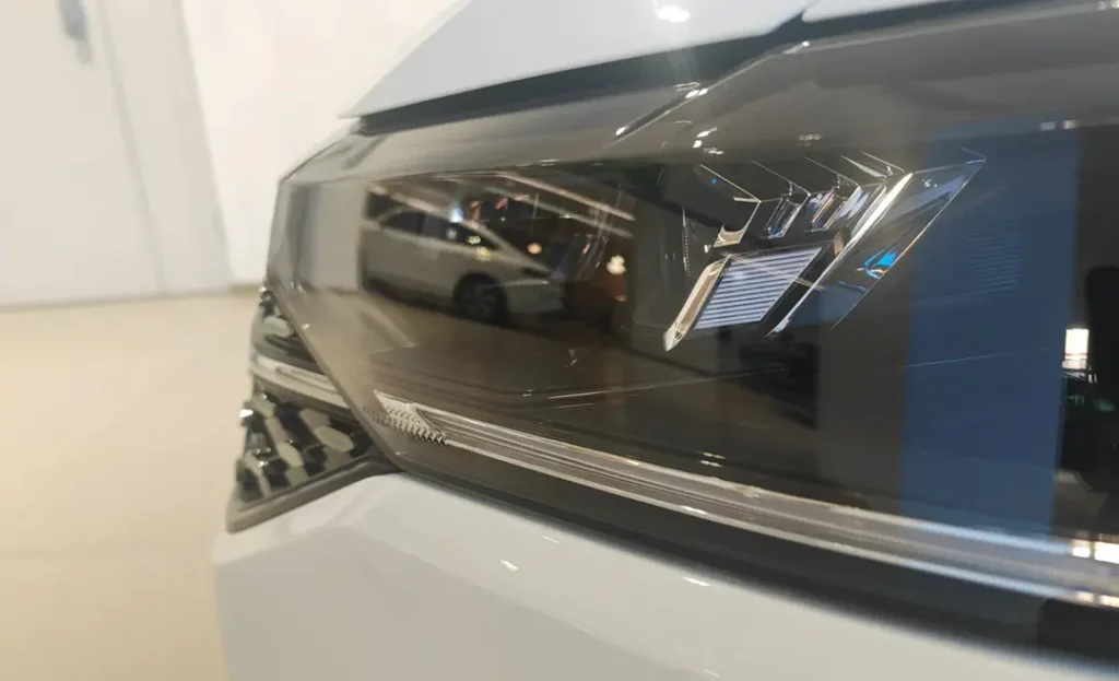 Volkswagen Lavida after a bi-xenon projector headlight retrofit, showing the upgraded projector lens setup and improved beam control.